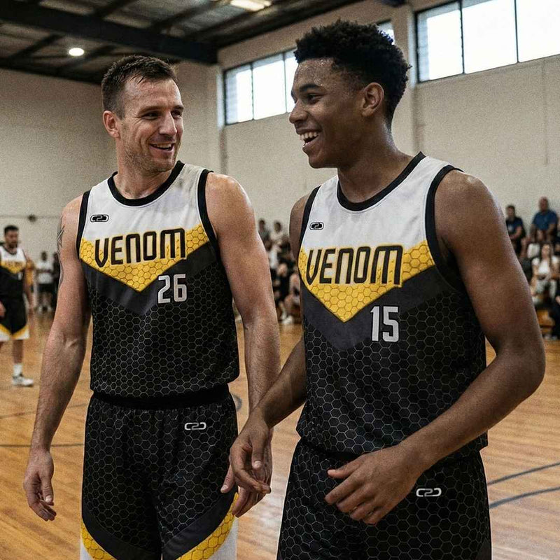Two players wearing black and yellow VENOM C2C Sport team uniforms with a honeycomb pattern and chevron design on the court.